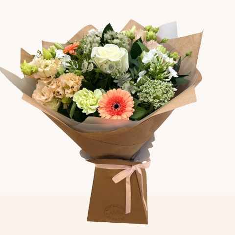 Late summer hand-tied bouquet with peach, cream and white seasonal flowers, fresh greenery and gift box.