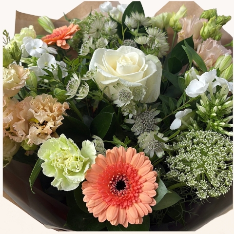 Late summer hand-tied bouquet with peach, cream and white seasonal flowers, fresh greenery and gift box.