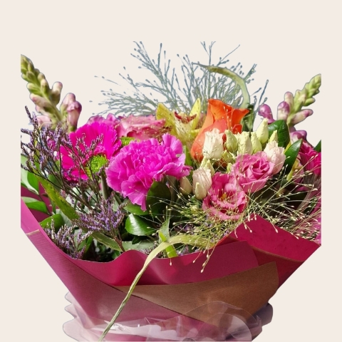 Bright summer hand tied bouquet with cerise purple orange and lime seasonal flowers