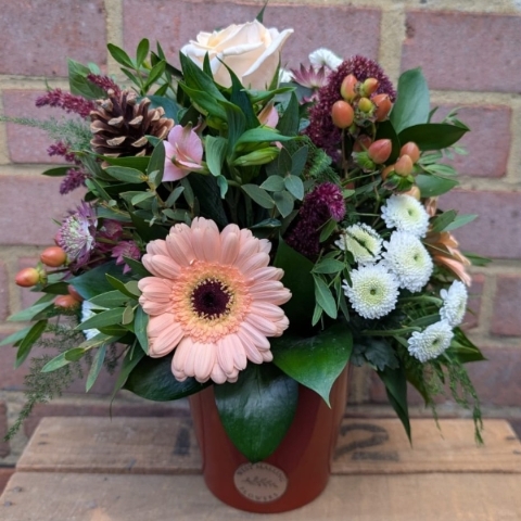 Autumn Haze ceramic pot arrangement with peach, blush, bronze and burgundy seasonal flowers