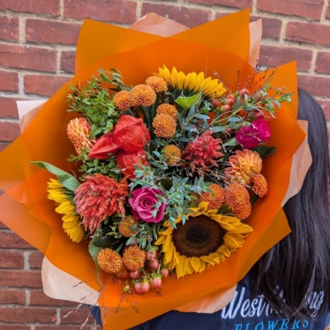 Autumn Glow hand-tied bouquet with raspberry, orange, bronze, yellow and burgundy seasonal flowers