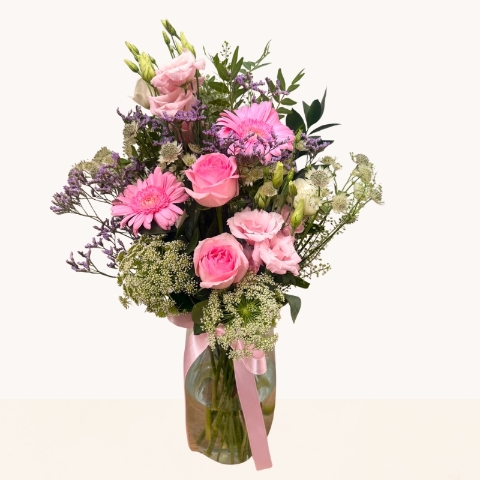 Summer Blush glass vase arrangement with pink roses, gerbera and soft pink, cream and lilac seasonal flowers