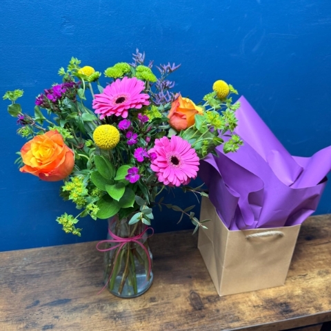 Colourful Mother’s Day vase arrangement in a clear glass vase with bright seasonal flowers, New York collection West Malling