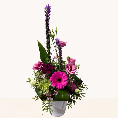 Summer Splash ceramic pot arrangement with vibrant pink and purple seasonal flowers by West Malling Flowers