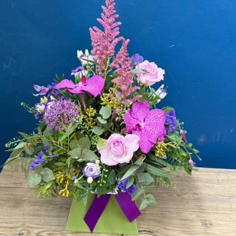 Summer flower box arrangement with pink lilac and purple seasonal flowers