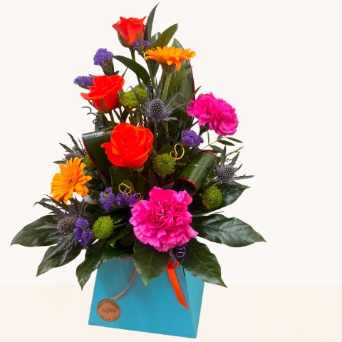 Summer Splash vibrant flower box arrangement with bright pink, orange, purple and blue seasonal flowers