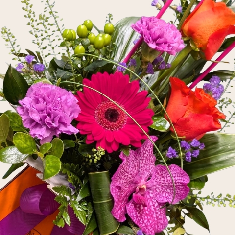 Summer flower box arrangement with pink lilac and purple seasonal flowers