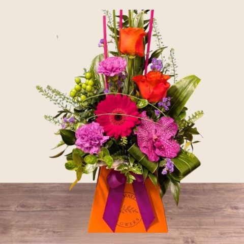 Summer flower box arrangement with pink lilac and purple seasonal flowers