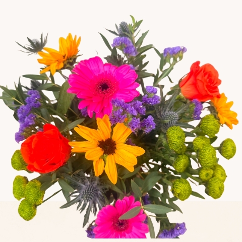 Summer Splash blue glass vase arrangement with vibrant pink, orange, purple and green seasonal flowers