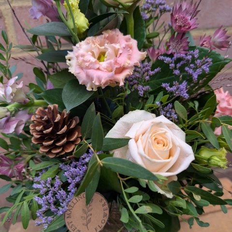 Autumn Blush seagrass pot arrangement with blush pink, champagne and lilac seasonal flowers