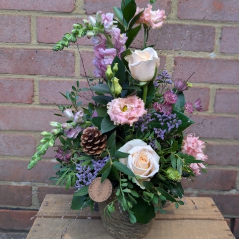 Autumn Blush seagrass pot arrangement with blush pink, champagne and lilac seasonal flowers