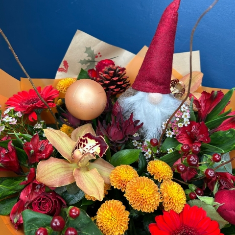 Christmas hand-tied bouquet with seasonal flowers by West Malling Flowers
