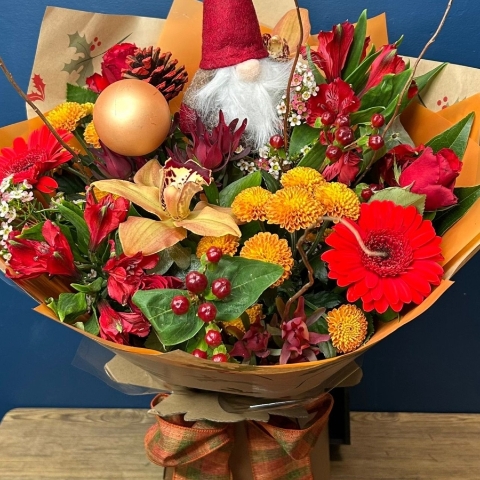 Christmas hand-tied bouquet with seasonal flowers by West Malling Flowers