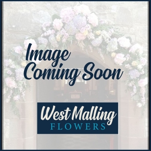 Pinned wedding corsage with seasonal flowers in rich tones